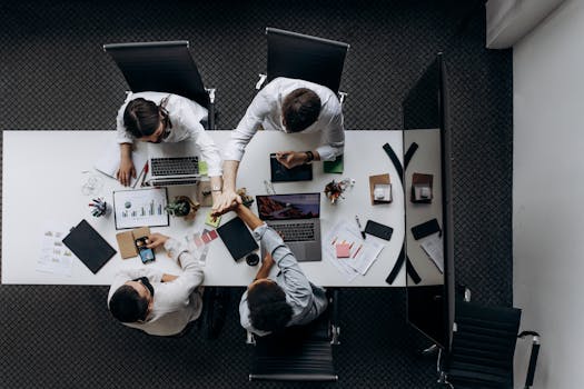 Collaborateurs discutant de l’intégration de l’IA et de la transformation digitale en entreprise.