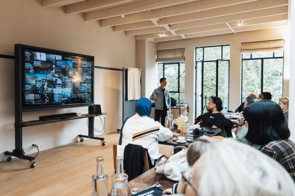 Corporate team engaged in a presentation in a modern office setting.